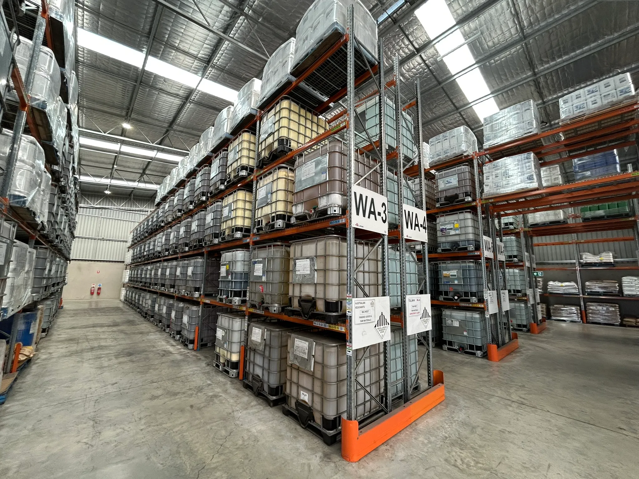 Tollman warehouse racking — palletised IBC totes with location coding